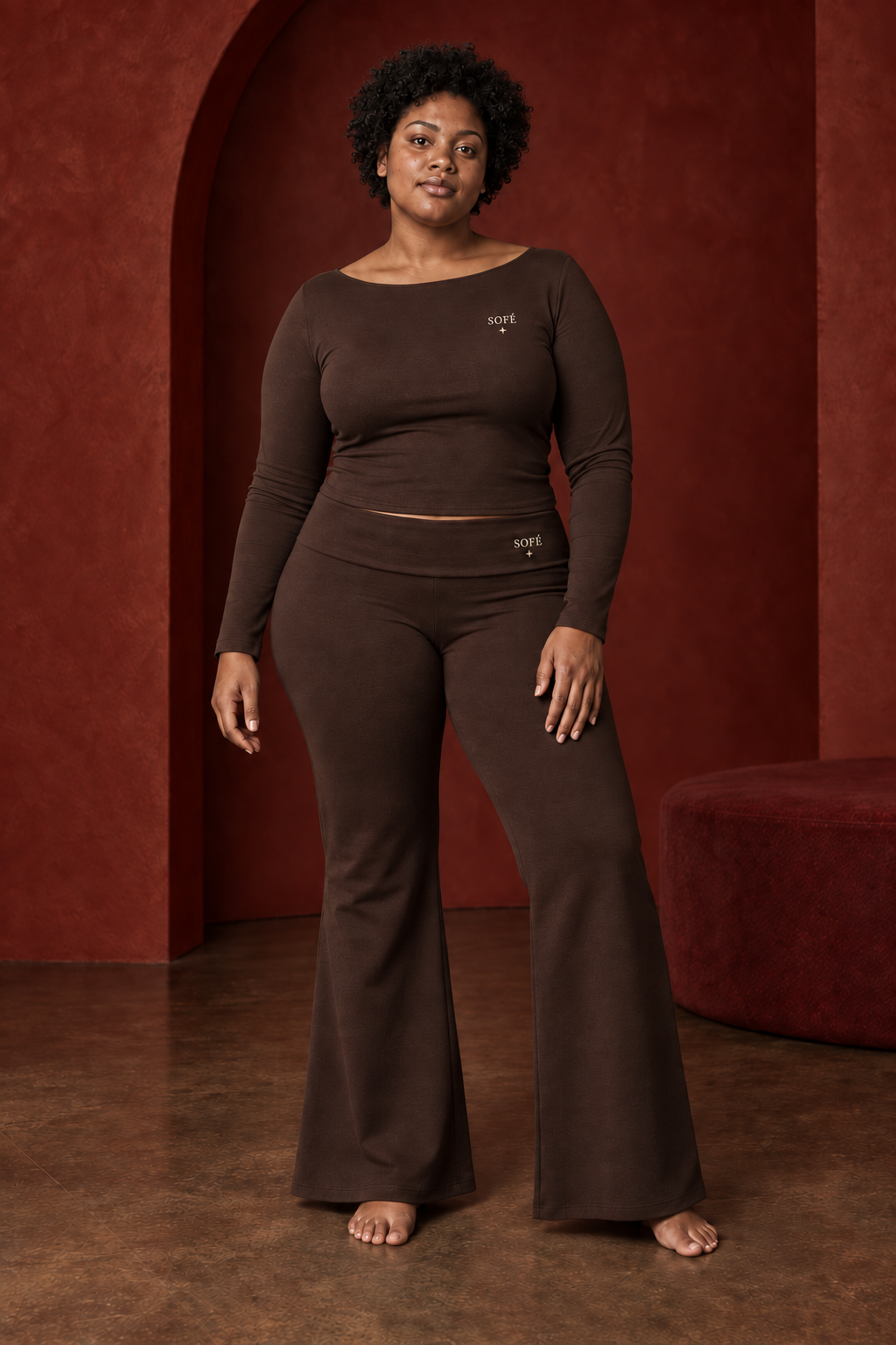 AI Sofé campaign concept: a plus-size model with natural curls in an Espresso fold-over set